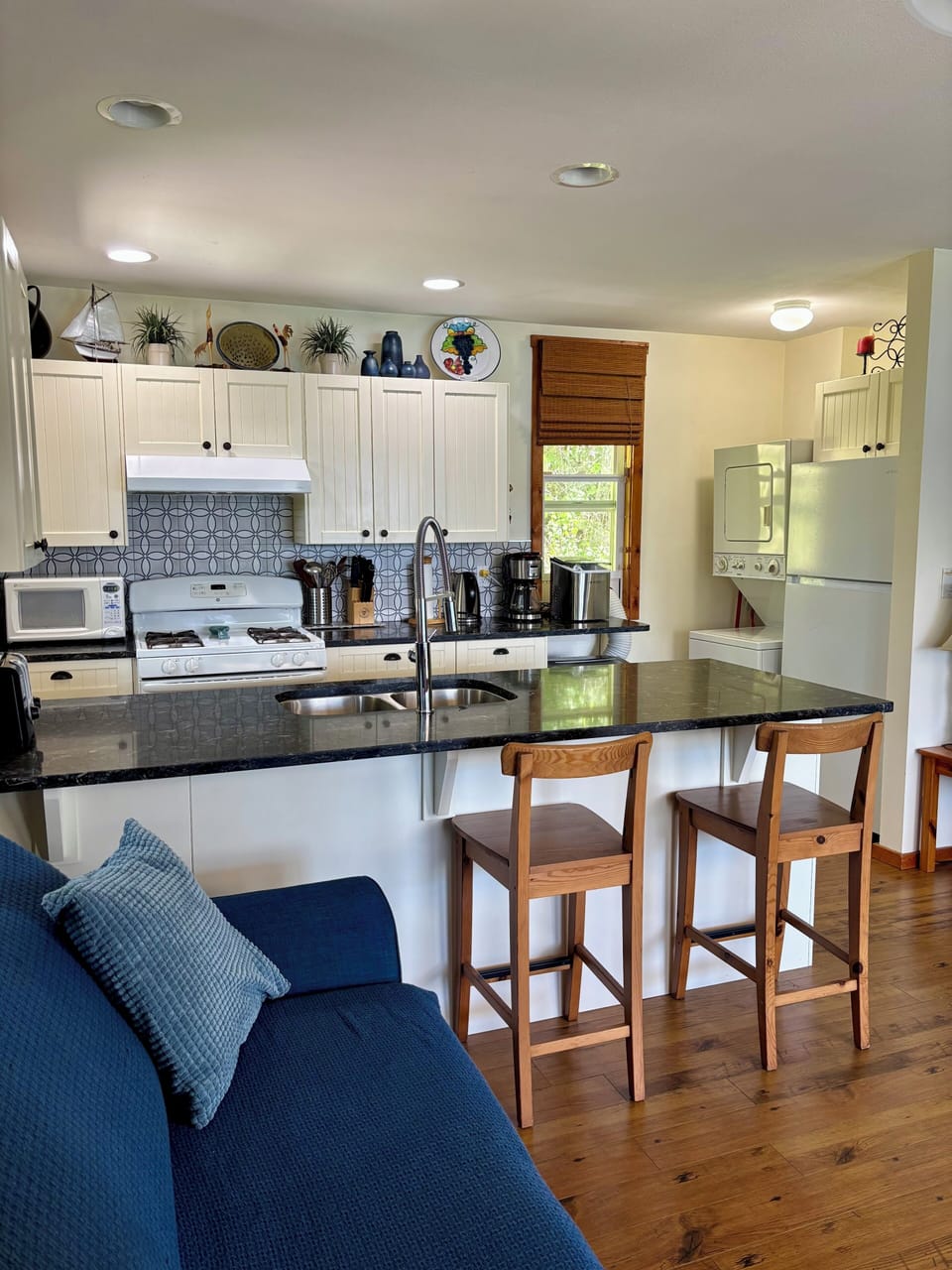 Stackable washer and dryer in kitchen area