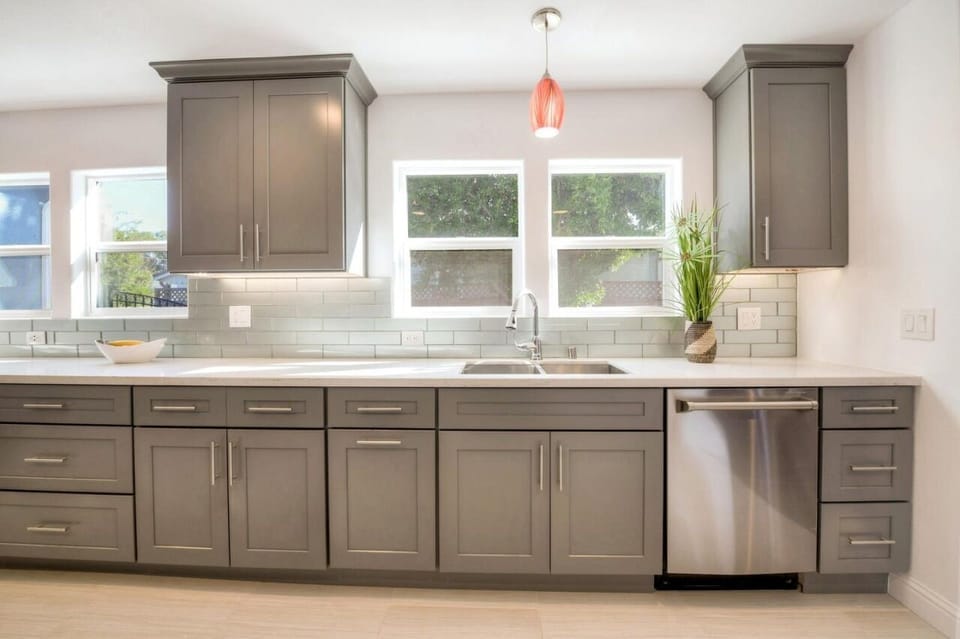 Extra large sized kitchen with cookware, pots, plates and cooking material