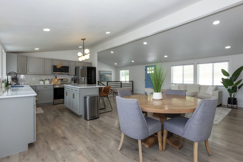 Beautifully furnished kitchen and dining area with plenty of counter space, cabinets, and seating for your indoor dining.