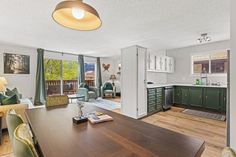 8-person dining area with large bench and antique seating.