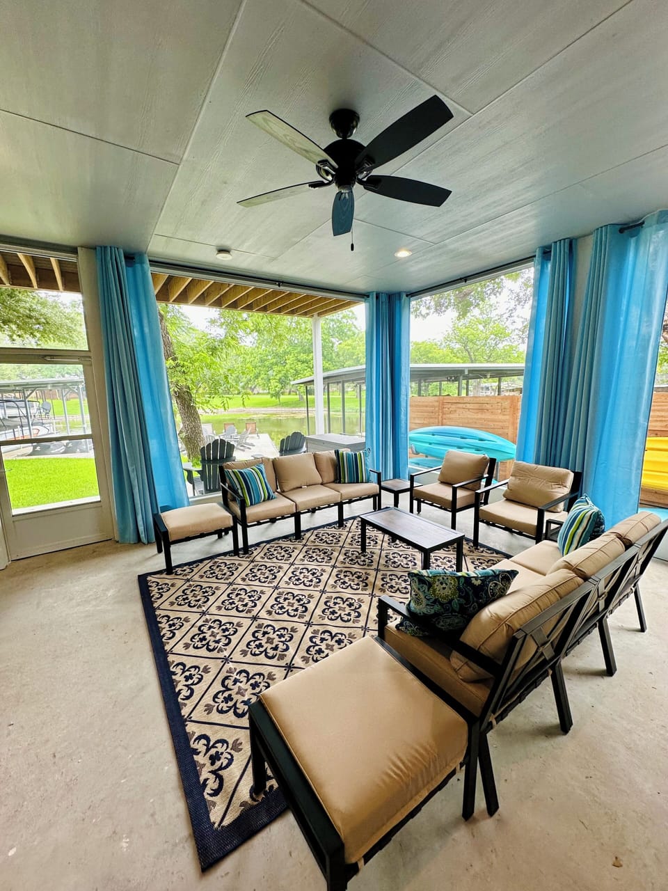 The screened living room lets you hang out and enjoy a view of the lake