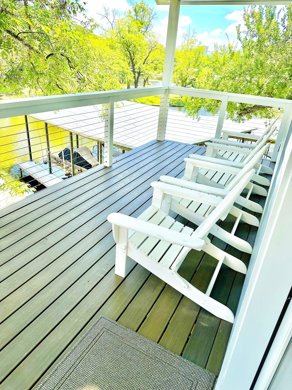 The adirondack chairs on the upper deck are perfect for enjoying a cool drink