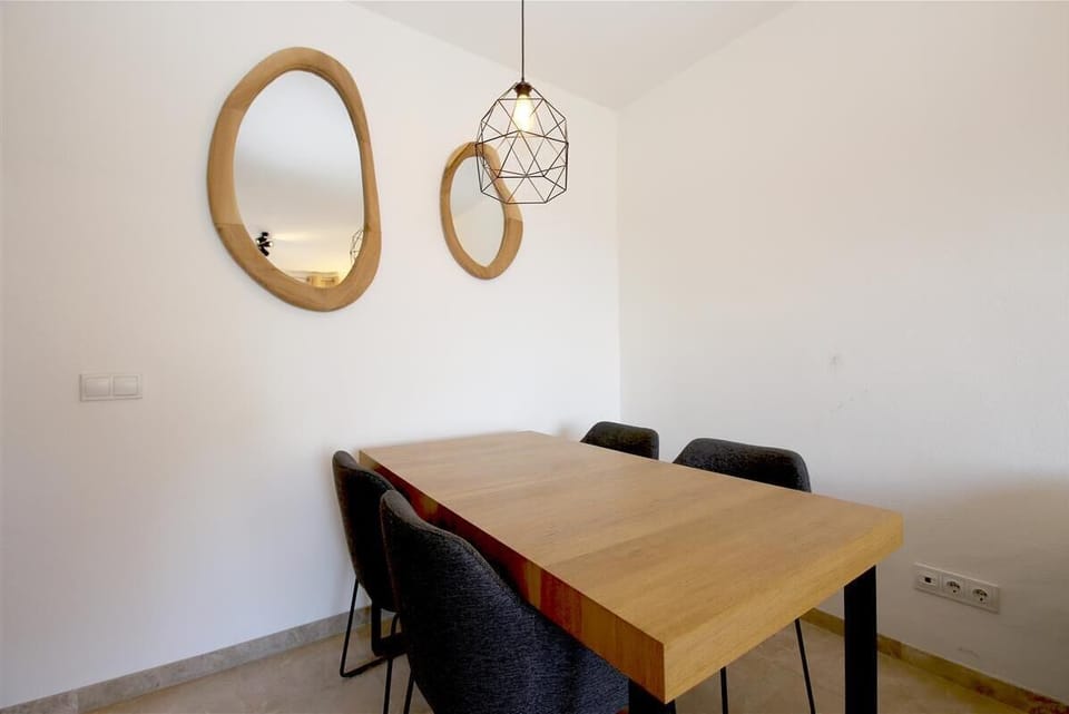 Dining area for four guests on a side of the living room