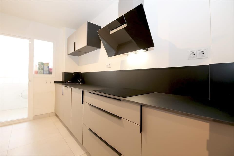 Modern fully fitted kitchen with laundry room to the rear