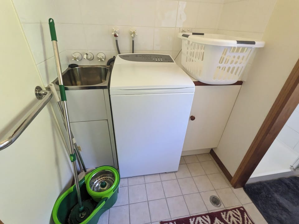 Laundry:  Washing machine, tub, basket, cleaning equipment.