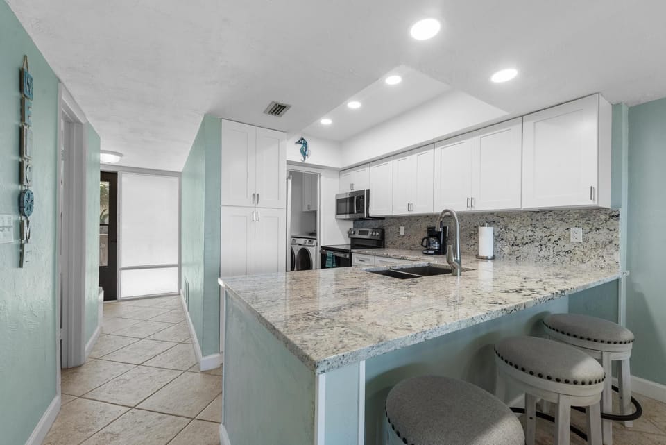 Bright open kitchen with an ocean view
