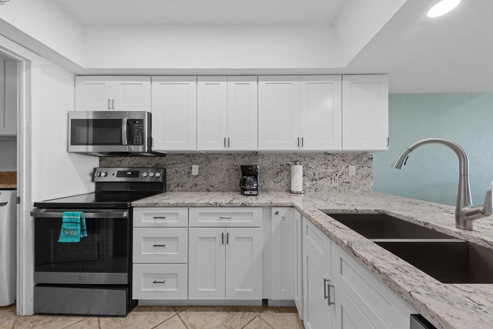 Updated and fully stocked kitchen with everything you need for easy meals.