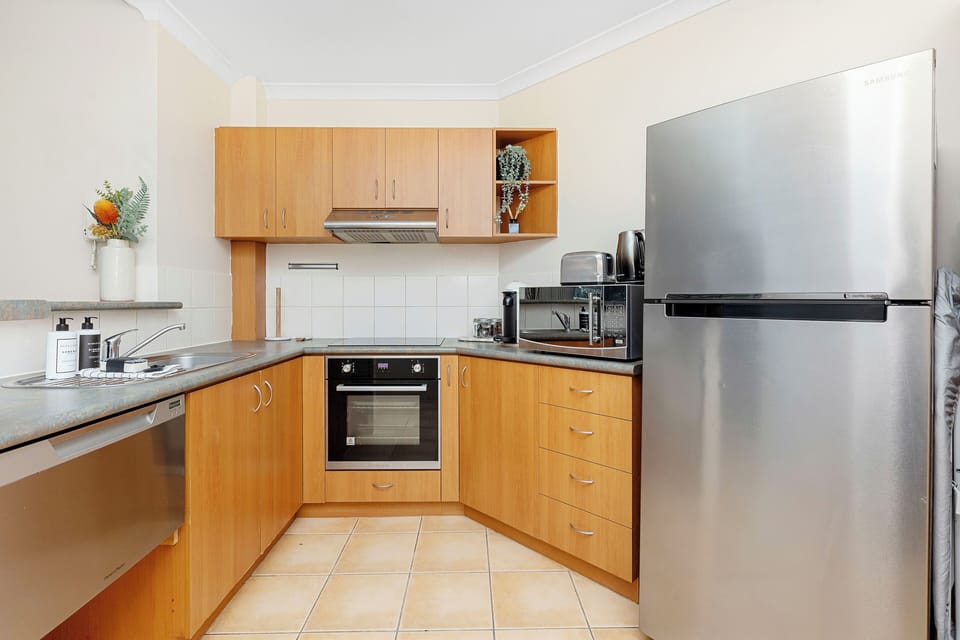 Fully equipped kitchen with modern appliances, sleek countertops, and all the essentials to cook your favourite meals, making it a delight for any culinary enthusiast.