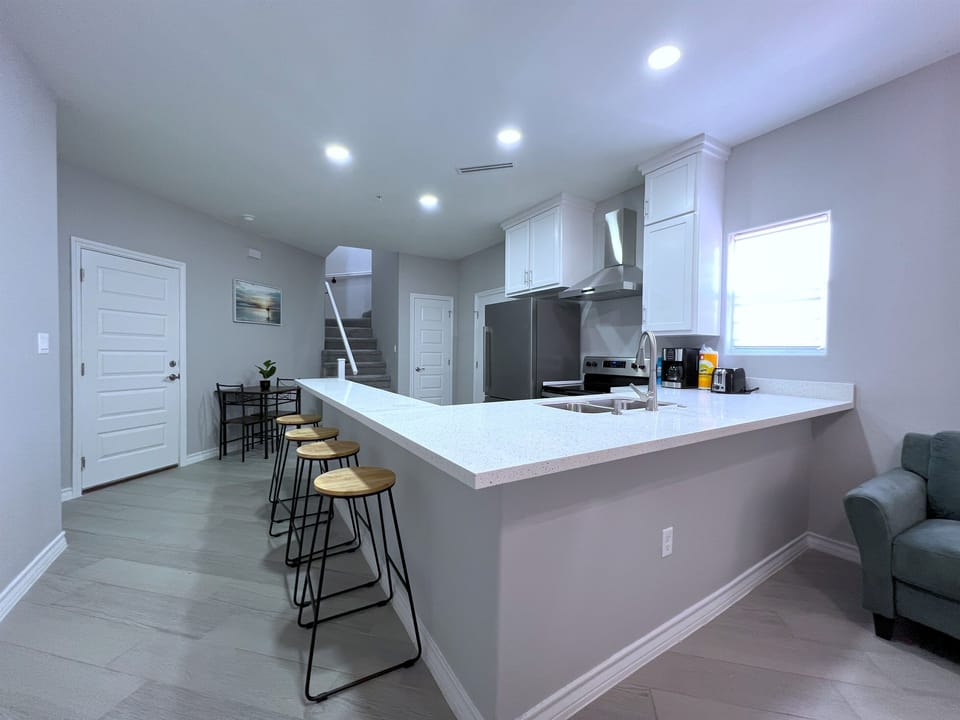 Kitchen with Dining Table and Bar Seating