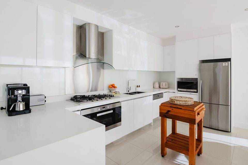 Whip up culinary masterpieces in our modern kitchen, where every detail is designed for your convenience and culinary creativity