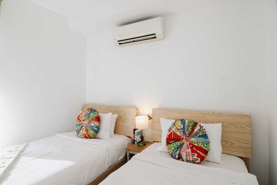 2 Single Beds with balcony access and large wardrobe.