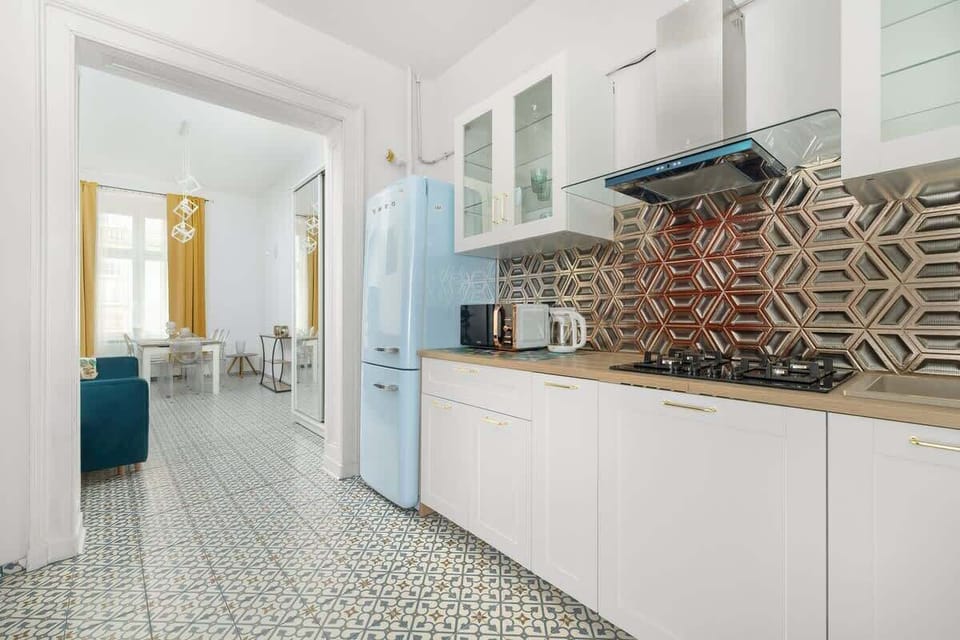 Kitchenette with a fridge.