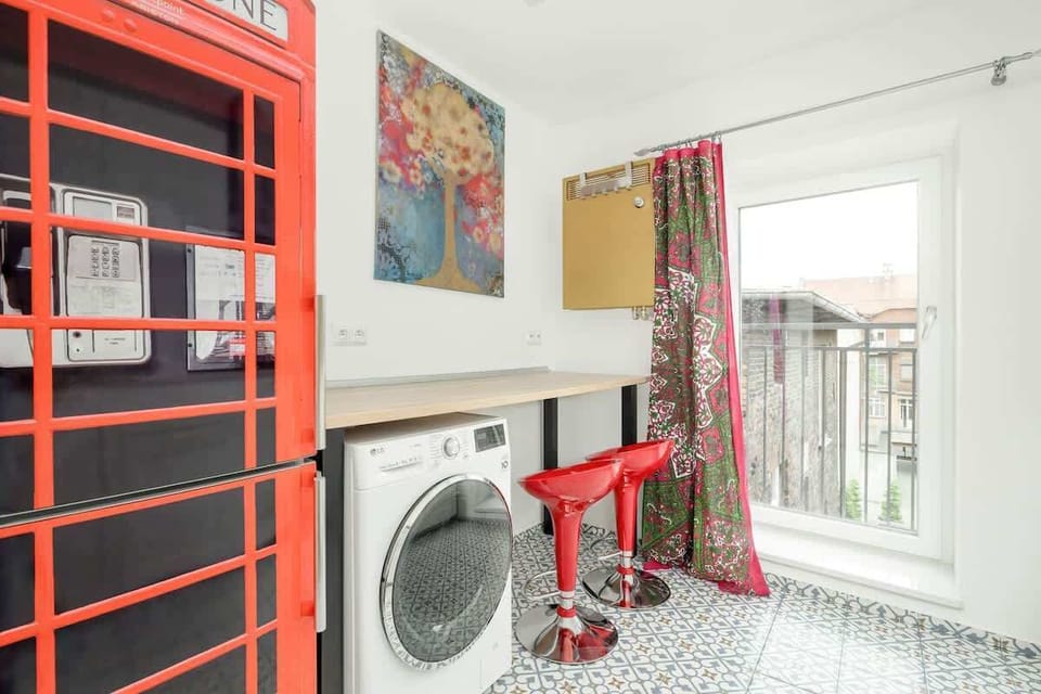 Separate kitchen with washing machine.