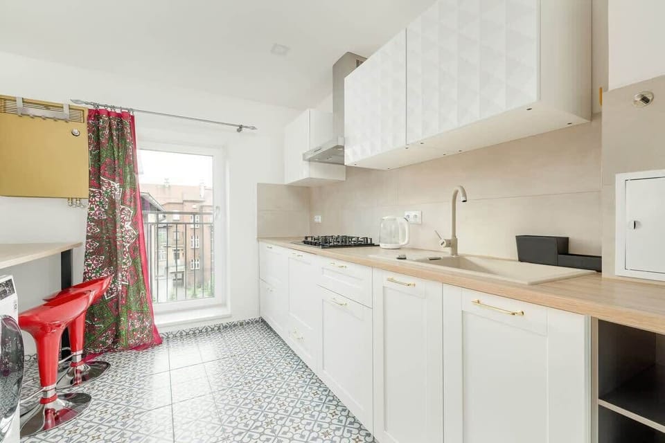 Kitchen with a microwave.