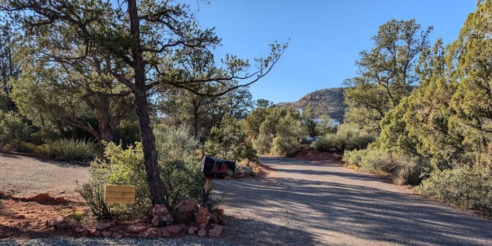 Find the gravel path just before the mailbox—your private entrance to Casita and its dedicated parking.