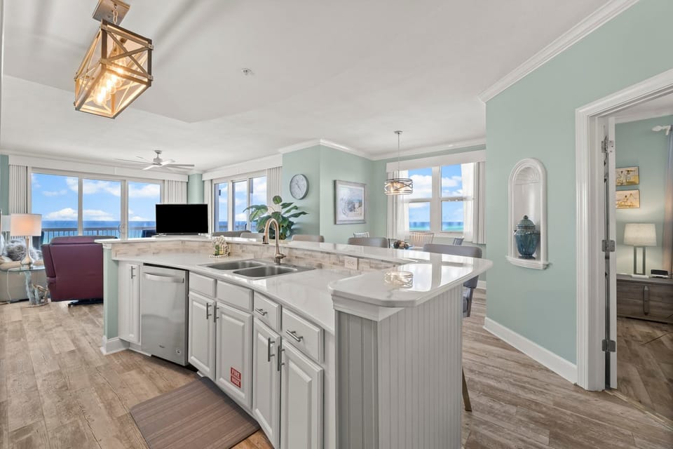 The updated kitchen features a large kitchen island, granite countertops, stainless-steel appliances, spacious pantry, and everything you need to prepare meals for family & friends.
