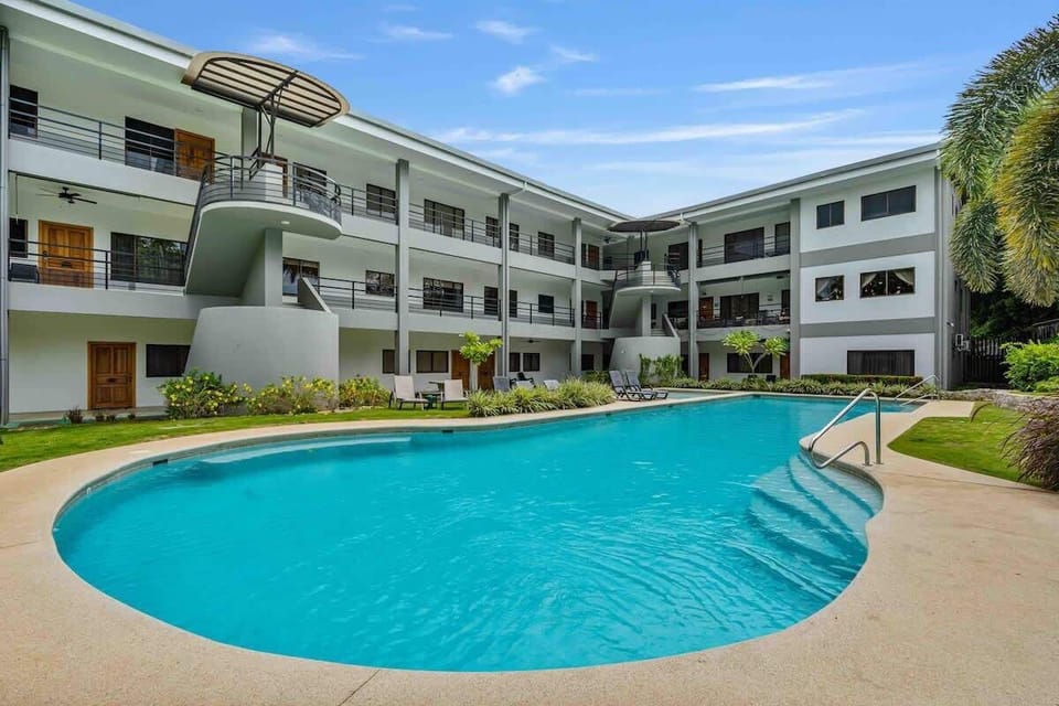Cool off and unwind by the community pool, just steps from the beach.