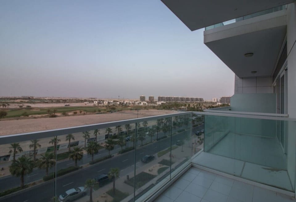 Sweeping outdoor view of a lush cityscape at golden hour — a stunning backdrop to wind down the day.