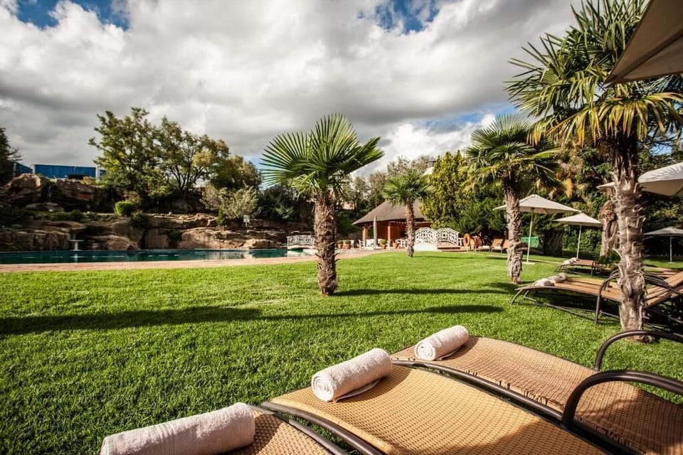 Sip something cold while the expansive pool invites you in.