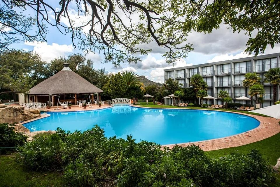 Picture yourself overlooking the lagoon-style pool and mountain backdrop.