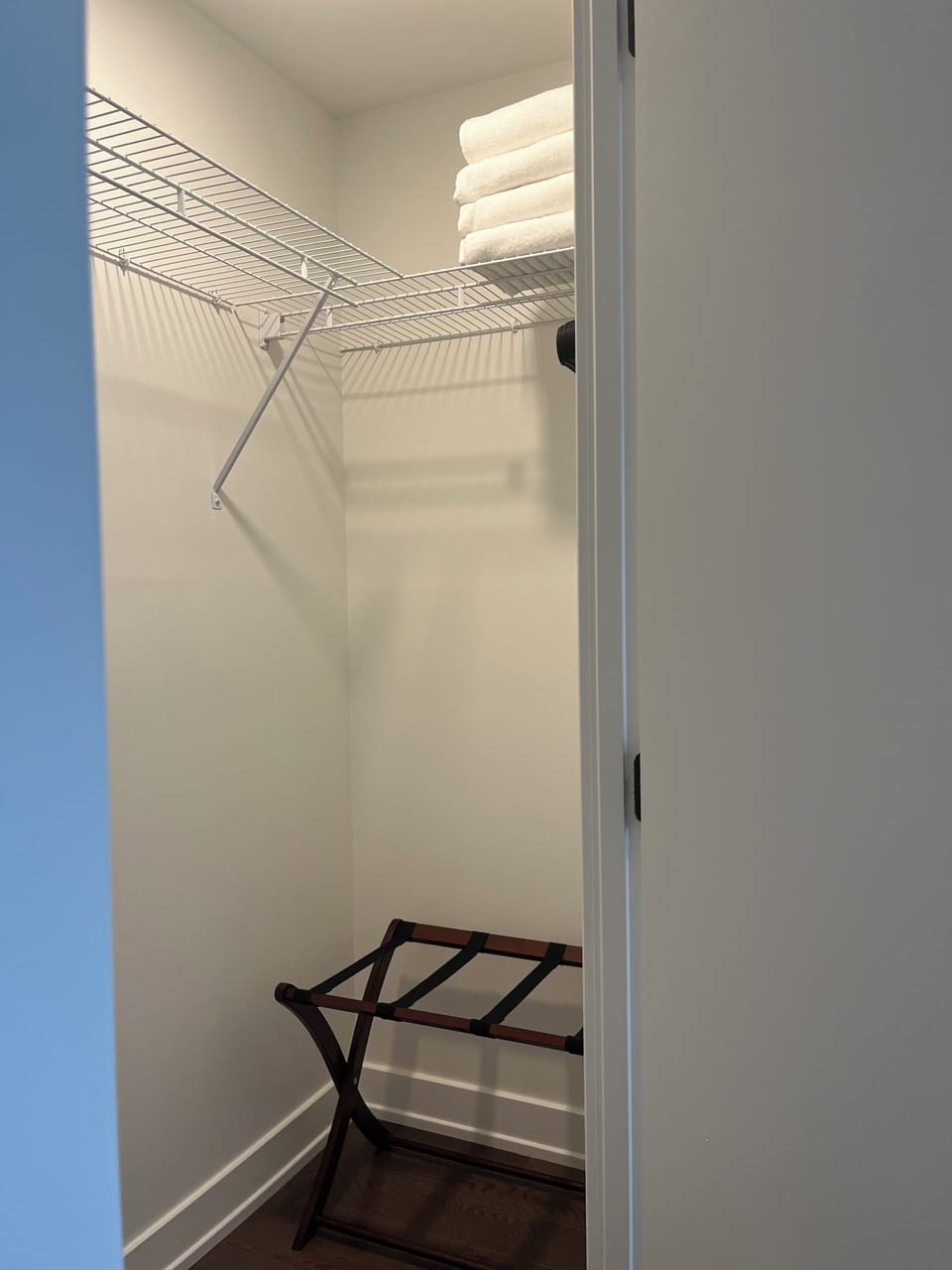 walk in closet with luggage storage