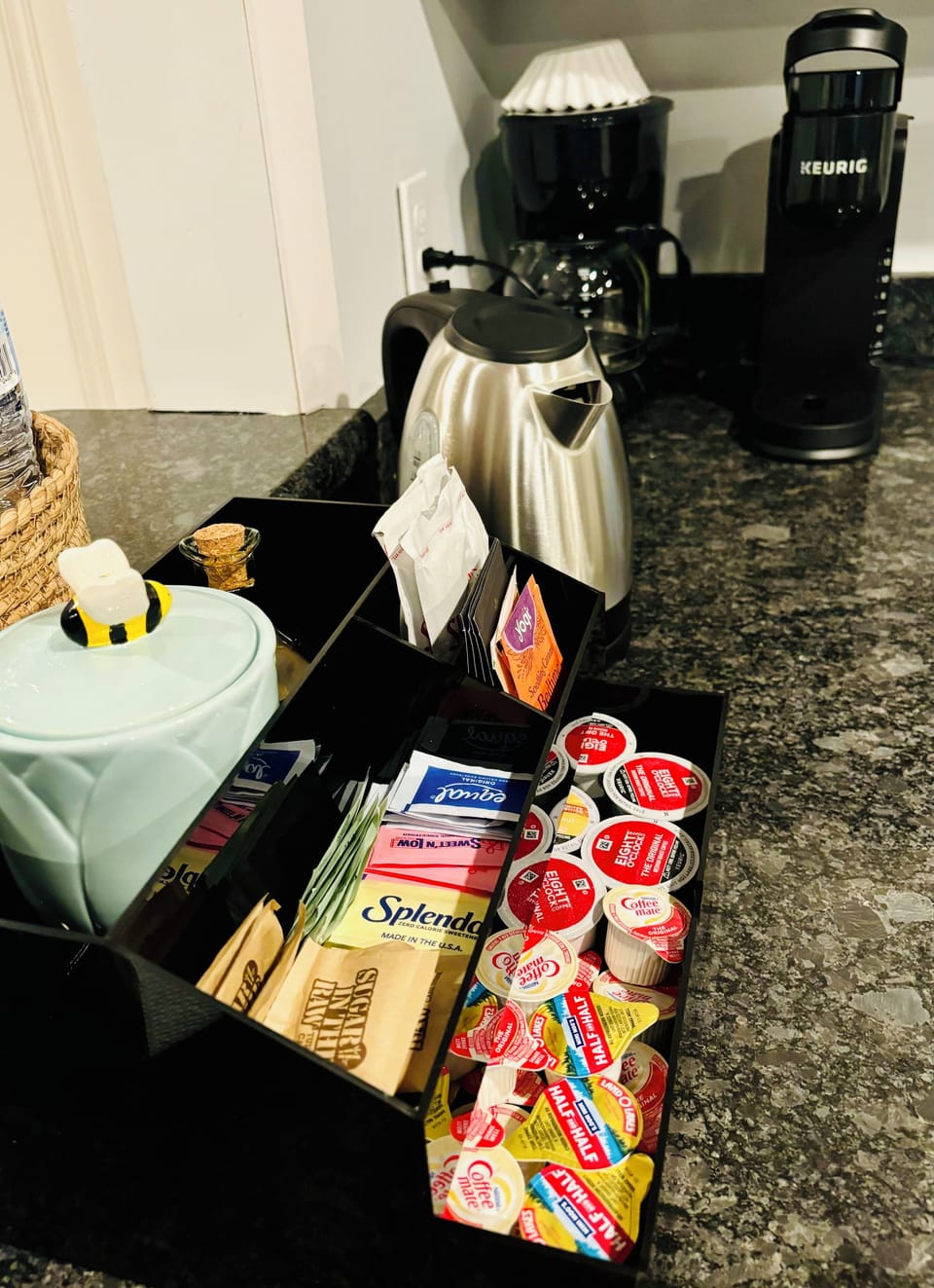 Coffee station with electric kettle, Keurig machine and coffee pot.