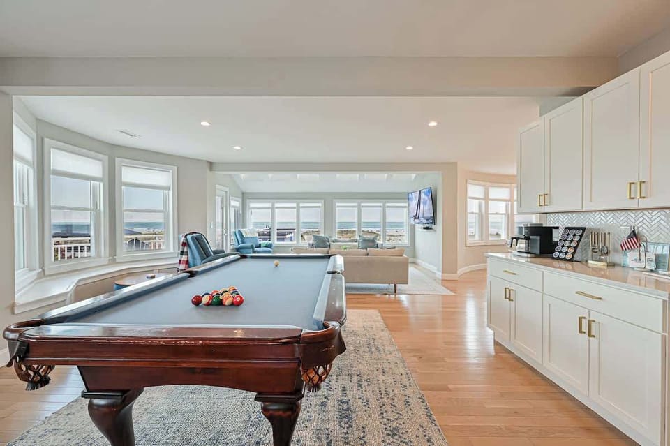 Open living game room, living room and high end kitchen