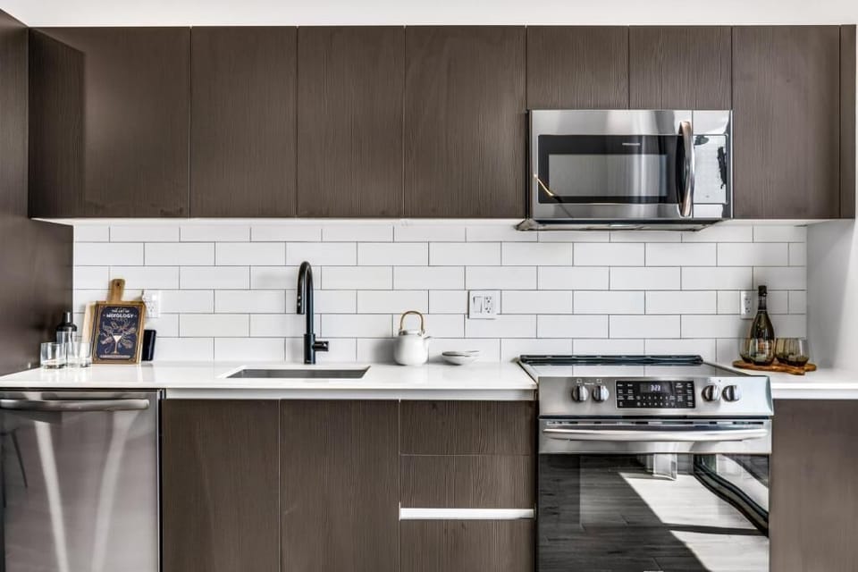 Cook with ease in a sleek kitchen with modern appliances.