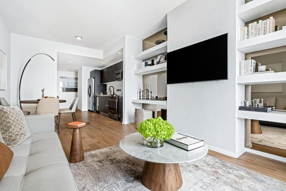 Spacious living room area. The exact unit will be assigned upon arrival. Views, colors and decor may vary.