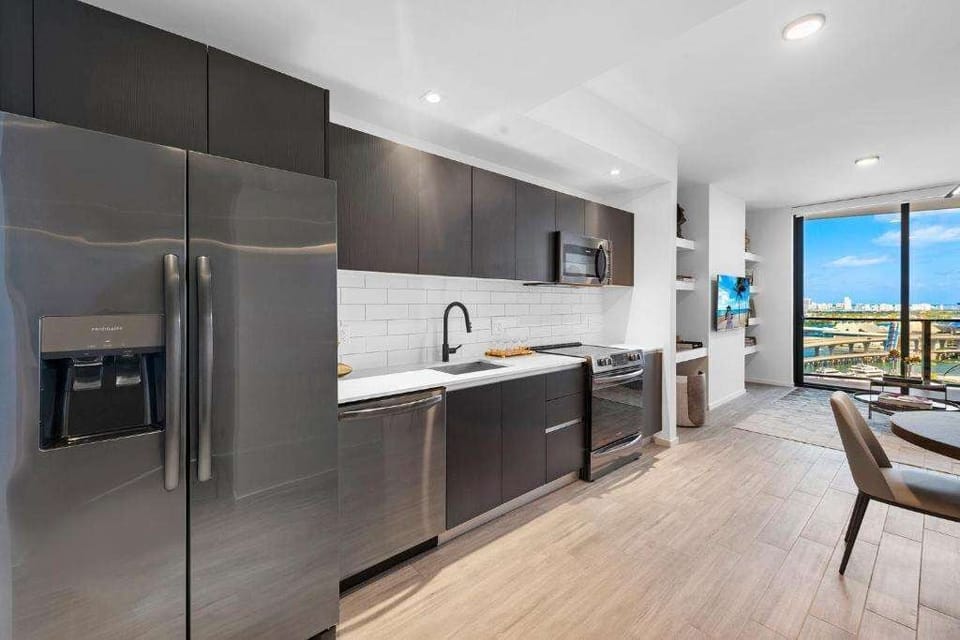 Cook with ease in a modern kitchen framed by city views.