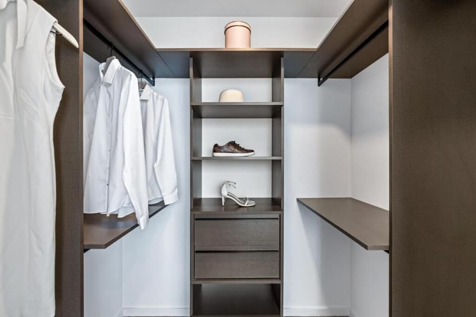 Organize outfits neatly with built-in shelving and hanging space.