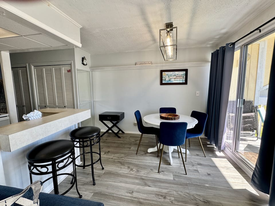 Gather around this stylish white dining table where your mornings begin with coffee and your evenings wind down with conversation.