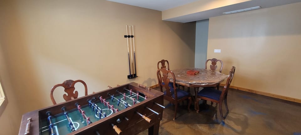 Gaming area in the basement. Sticks for bumper pool