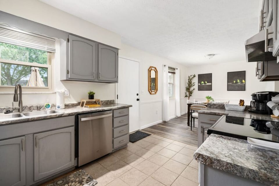 Fully Furnished Kitchen Open to Dining Area