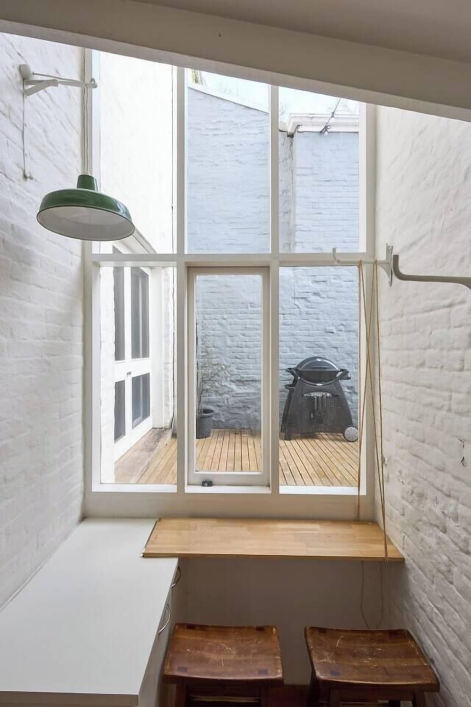A breakfast nook looks to the outdoors. This is an idyllic spot to sip your morning coffee.
