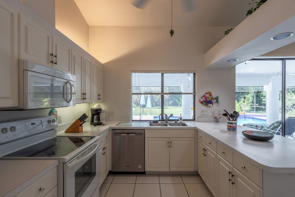 Fully equipped kitchen with stainless steel appliances.