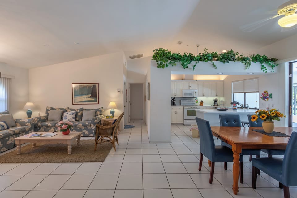 Open-concept living area with dining and open kitchen.