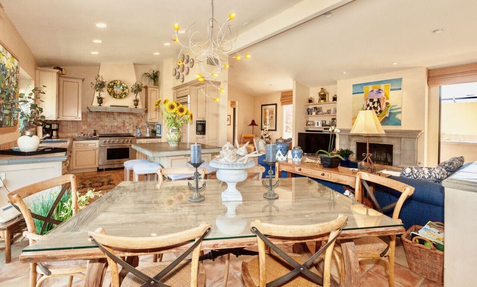 Beautiful natural light highlights the vaulted ceiling of the spacious living area.