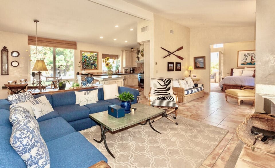 Second floor open living area. French doors lead to the primary suite and balcony.