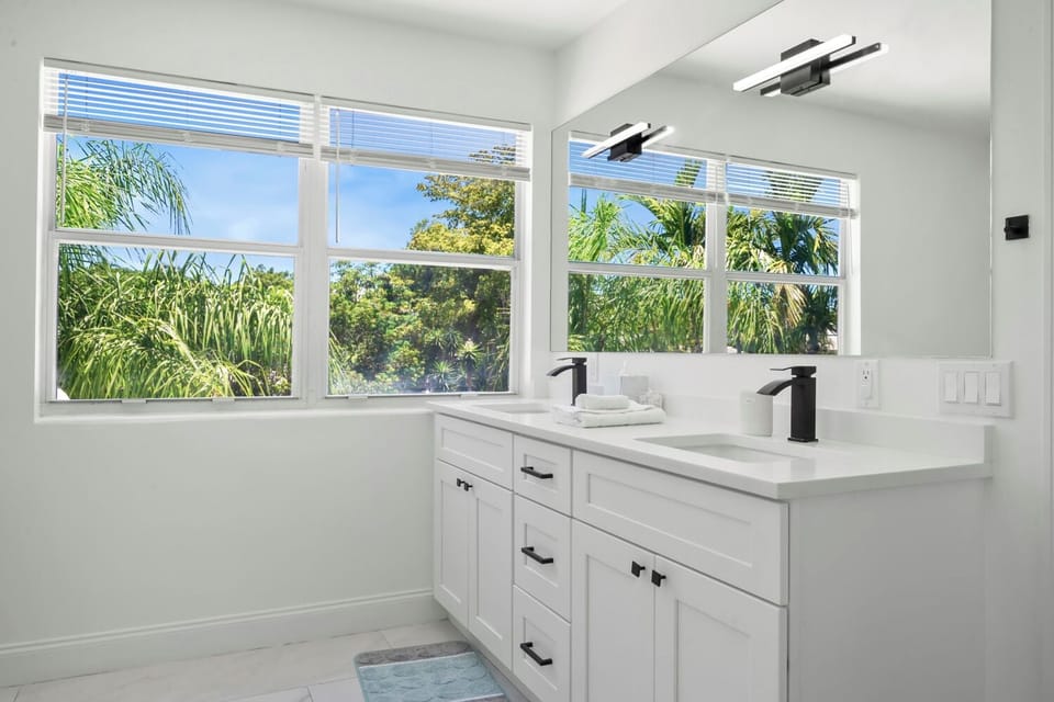 Master bathroom with bath towels, body wash, shampoo, and conditioner. 