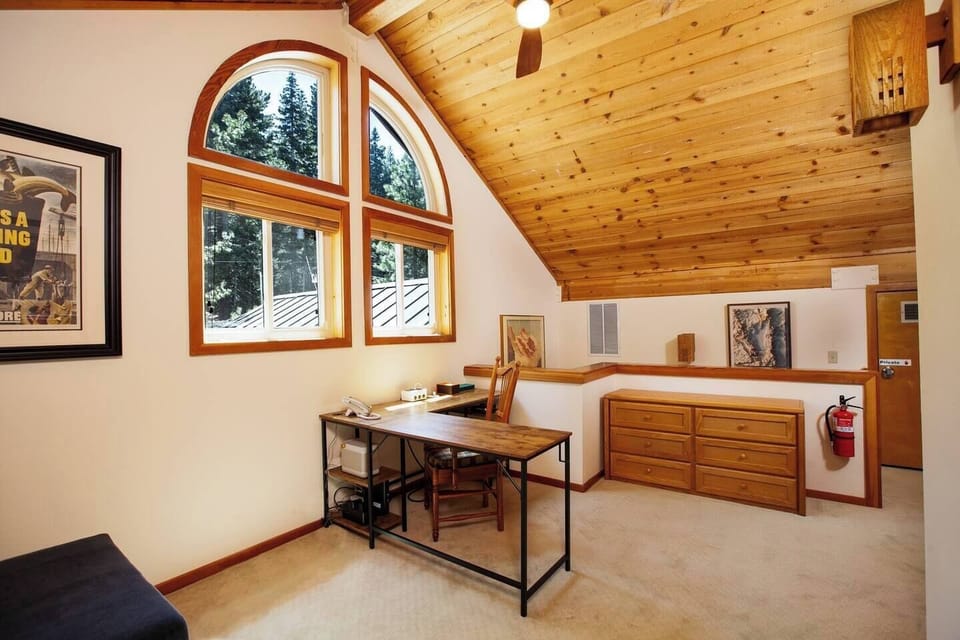 Large L shaped desk in loft area. 