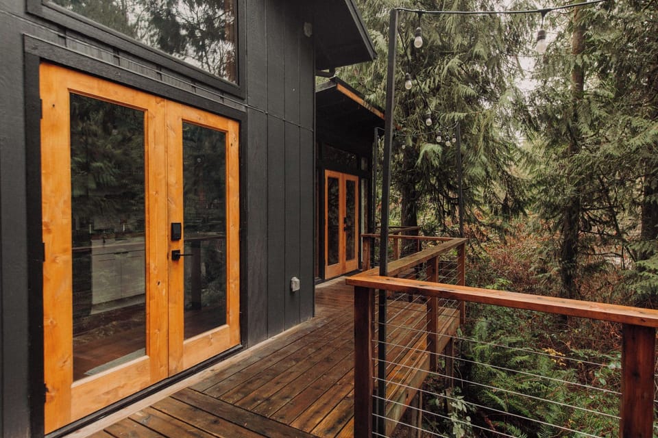 Deck view of the cabin with the Sleep Shed in the distance