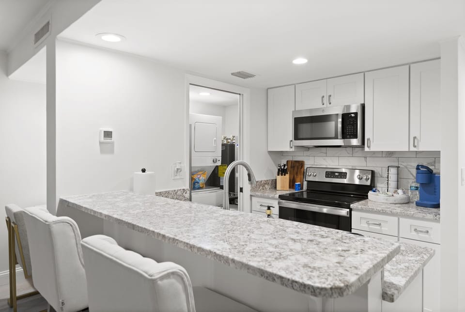 Bright modern kitchen with bar seating for two.