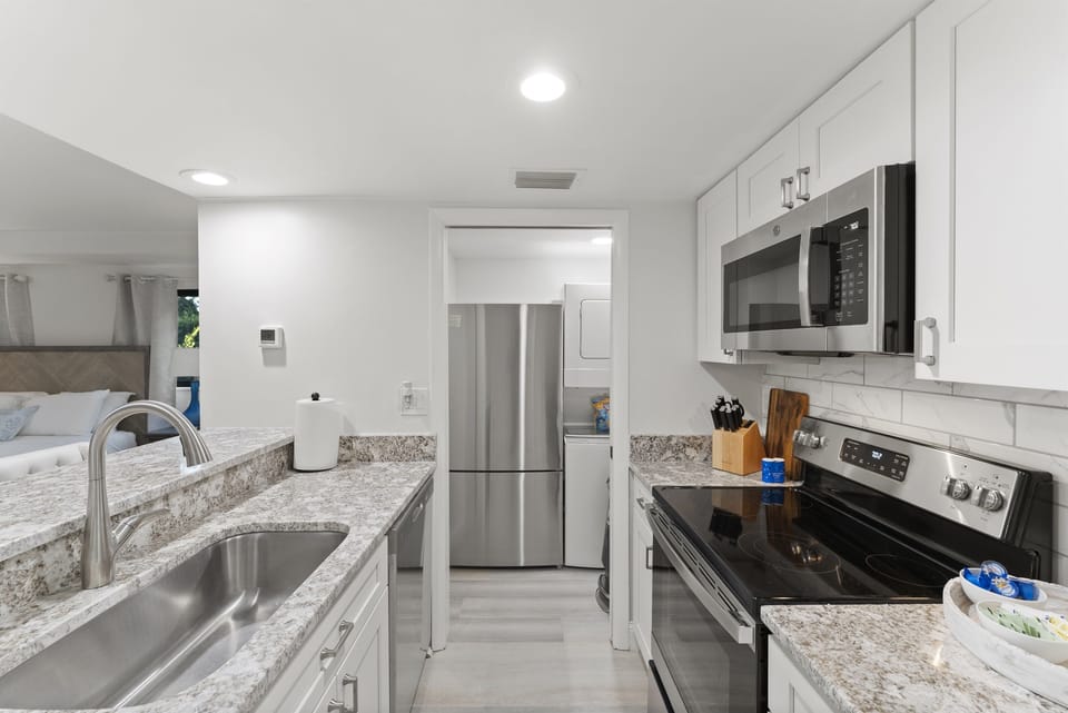 Clean and modern kitchen with stainless appliances and plenty of counter space.