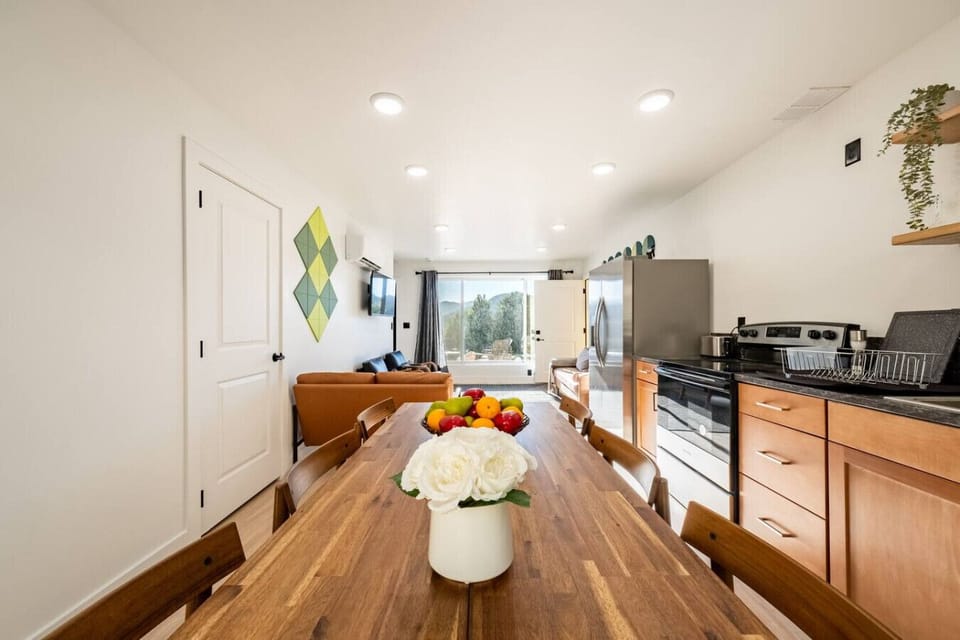 The dining area and kitchen looking back toward the living room.