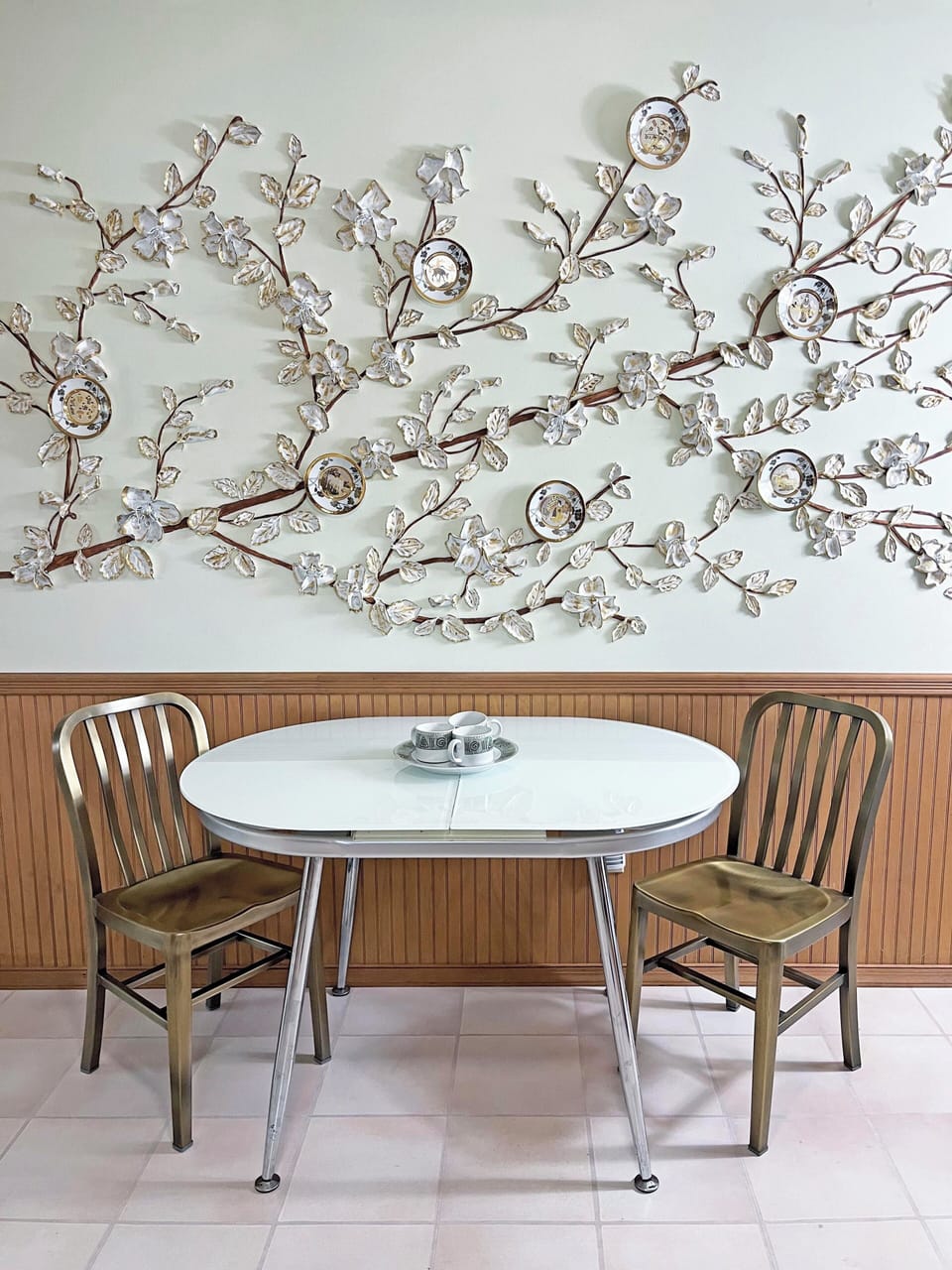 Cozy breakfast nook with artistic wall décor—perfect for morning coffee.