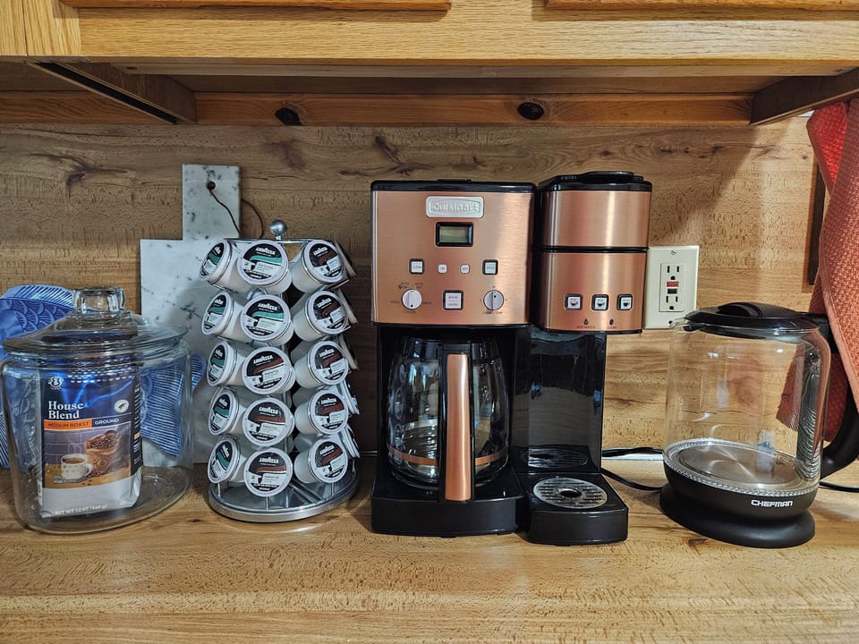 Wake up to a fully stocked coffee bar with pods, drip, and tea options!
