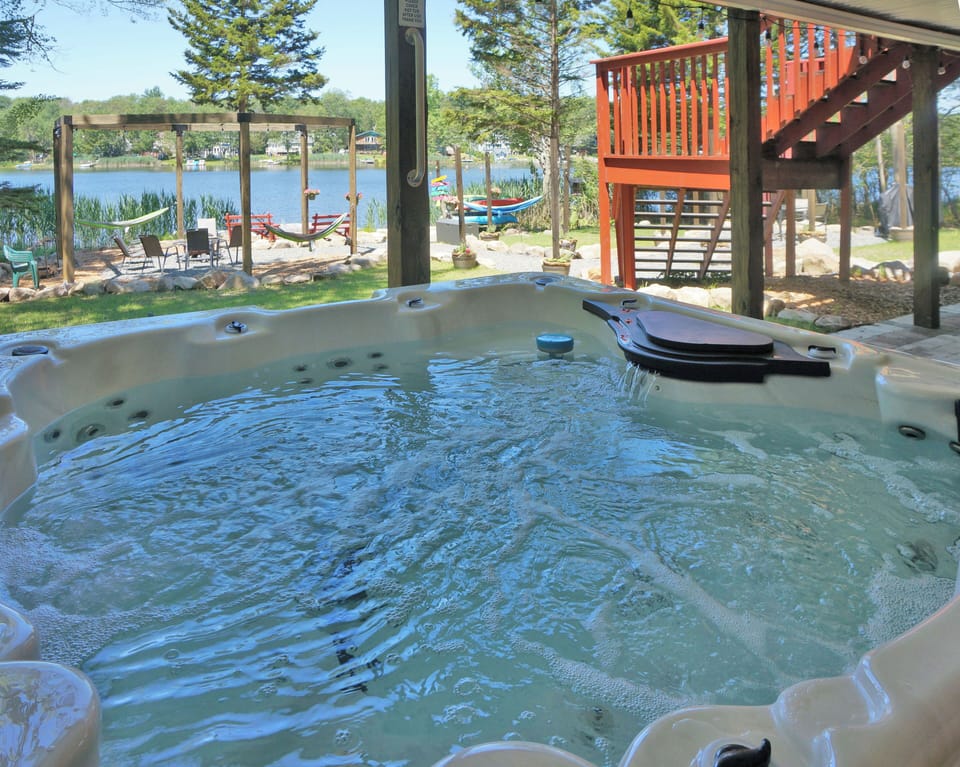 Relax in our lakeside hot tub with stunning views of the water.
