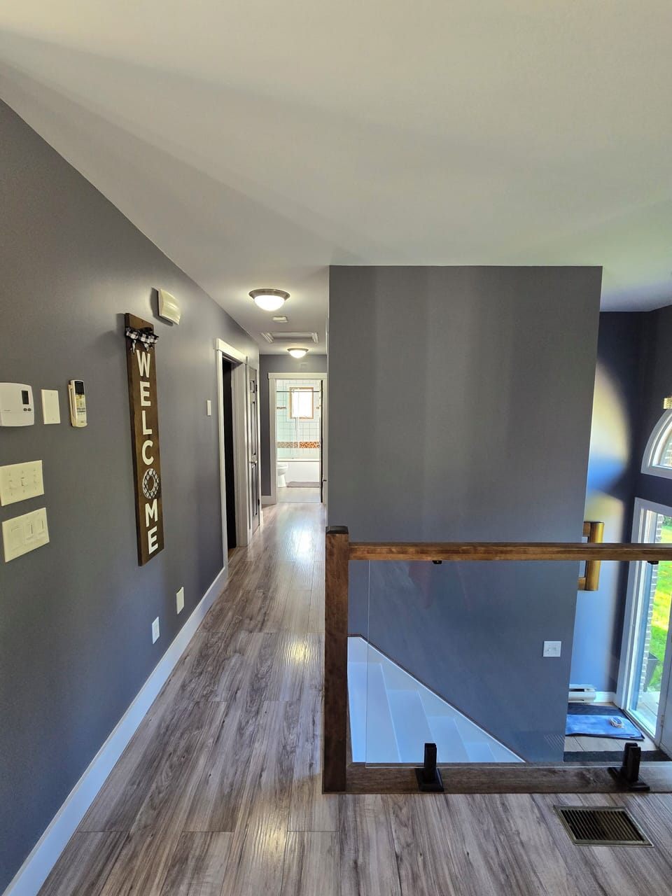 Hallway from living room to bedroom, bathroom and office area