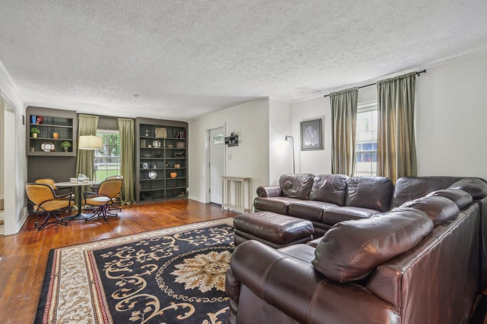 Another view of the living room. Comfy leather couch with plenty of seating